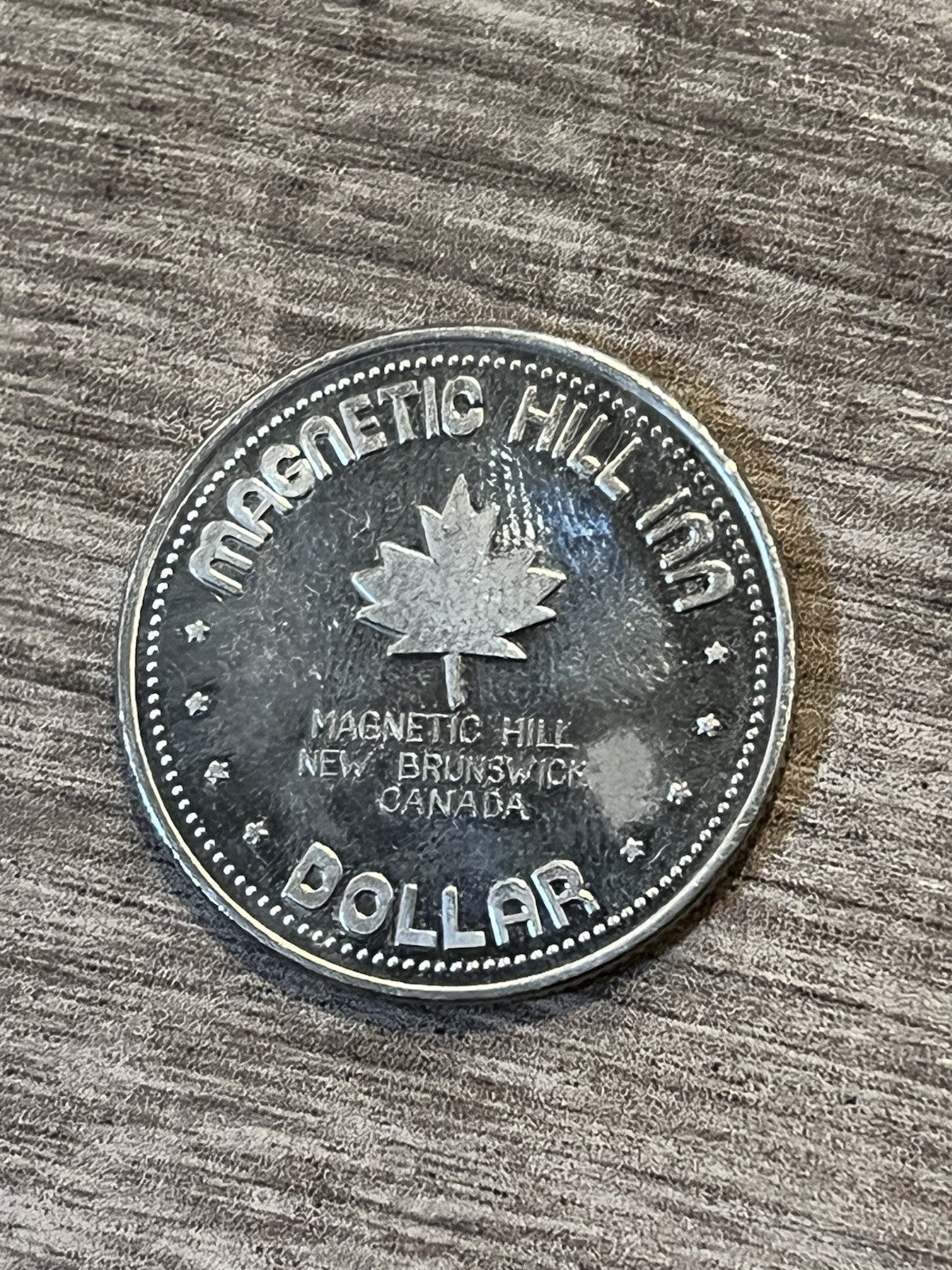 Moncton, New Brunswick 1979 Souvenir Dollar: Magnetic Hill
