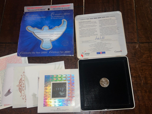 1999-2000 Millennium Keepsake Coin And Stamps (DENT IN BOX)