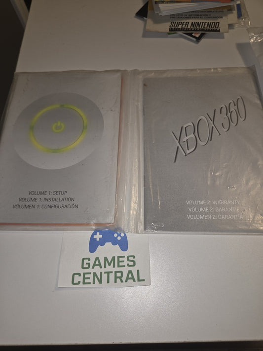 Xbox 360 Console Instruction Manuals; Vol. 1 Setup, Vol. 2 Warranty.